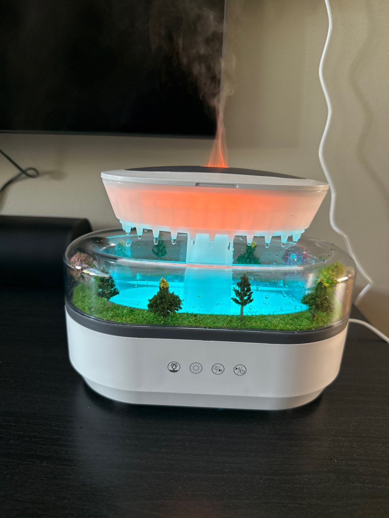 Misthaus on desk with orange flame diffusing